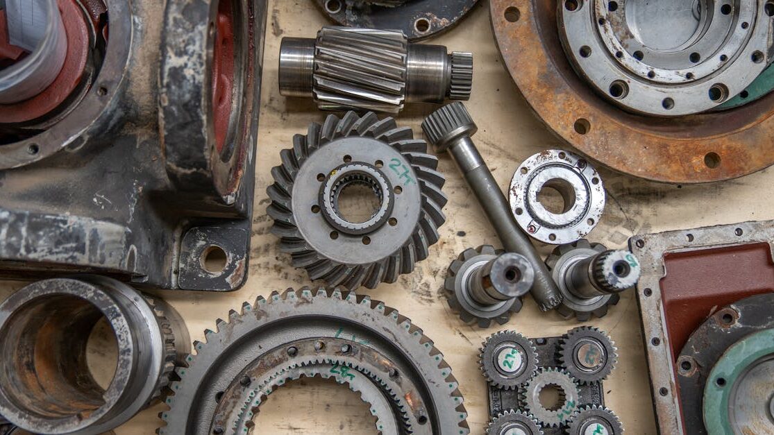 pexels-photo-28752152-28752152 Detailed shot of industrial gears and mechanical parts in a workshop setting.
